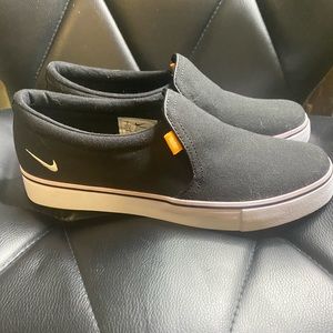 Slip on Nike shoes.